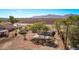 Large backyard featuring mature trees and privacy creating a serene outdoor setting with mountain views at 11124 W Southern Ave, Tolleson, AZ 85353