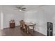 Dining area features hardwood floors, a ceiling fan and a window with natural light at 11124 W Southern Ave, Tolleson, AZ 85353