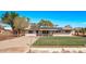 Charming single-story home featuring sustainable solar panels and a well-manicured lawn with modern appeal at 11124 W Southern Ave, Tolleson, AZ 85353