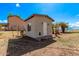 Charming outbuilding featuring a neutral stucco exterior, new roof, and secure entrance, perfect for storage or hobby space at 11124 W Southern Ave, Tolleson, AZ 85353