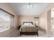 Primary bedroom with large windows, neutral walls, and ceiling fan at 12787 S 175Th Ave, Goodyear, AZ 85338