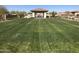 Expansive lawn with a gazebo perfect for outdoor gatherings and relaxation at 12787 S 175Th Ave, Goodyear, AZ 85338