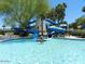 Community pool with water slides and a lifeguard on duty for a safe and fun environment at 12787 S 175Th Ave, Goodyear, AZ 85338