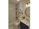 Stylish bathroom with decorative mirror, bright lighting, and modern sink and fixtures at 12807 N 21St Dr, Phoenix, AZ 85029