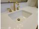 Bathroom close up of sink, white countertop, and bronze fixtures at 12807 N 21St Dr, Phoenix, AZ 85029