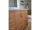 Bathroom boasting a wood vanity, contemporary bronze fixtures, and stylish decor at 12807 N 21St Dr, Phoenix, AZ 85029