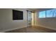 Bedroom features wood floors, modern barn door and sleek decor at 12807 N 21St Dr, Phoenix, AZ 85029