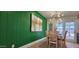 Dining area with a unique green accent wall at 12807 N 21St Dr, Phoenix, AZ 85029