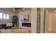 Comfortable living room featuring a modern fireplace, recessed lighting and arched doorways in a neutral palette at 12807 N 21St Dr, Phoenix, AZ 85029