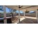 Inviting covered patio with ceiling fans, views of the yard, and tiled outdoor kitchen at 12807 N 21St Dr, Phoenix, AZ 85029