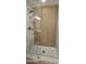 Bathroom features a glass shower door, tile shower walls and bronze fixtures at 12807 N 21St Dr, Phoenix, AZ 85029