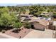 Aerial view of a home with solar panels with mountain views in the background at 12809 N 50Th St, Scottsdale, AZ 85254