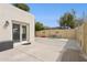 Backyard featuring a private patio, sliding glass door, and perimeter fencing at 12809 N 50Th St, Scottsdale, AZ 85254