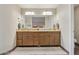 Bathroom featuring dual sink vanity with granite counters and tile flooring at 12809 N 50Th St, Scottsdale, AZ 85254