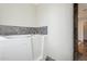 Bathroom featuring accessible tub, tile accents, and tiled floor at 12809 N 50Th St, Scottsdale, AZ 85254