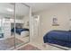 Bedroom featuring a built in bunk bed with plush carpet and a large sliding mirror closet at 12809 N 50Th St, Scottsdale, AZ 85254