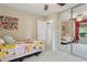 Well-lit bedroom with a ceiling fan, plush carpet, and a large sliding mirror closet at 12809 N 50Th St, Scottsdale, AZ 85254