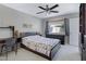 Cozy bedroom with carpet, a ceiling fan, a dresser, and lots of natural light at 12809 N 50Th St, Scottsdale, AZ 85254