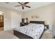 Bedroom with a ceiling fan, carpet floors, a bed, and a desk at 12809 N 50Th St, Scottsdale, AZ 85254