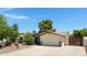 Street view of property featuring desert landscaping and a gated entrance on the right at 12809 N 50Th St, Scottsdale, AZ 85254