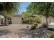 This home features desert landscaping and a two car garage at 12809 N 50Th St, Scottsdale, AZ 85254