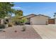 Charming home featuring a desert landscaped front yard and a two-car garage at 12809 N 50Th St, Scottsdale, AZ 85254