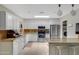 Kitchen with white cabinets, stainless steel appliances, granite countertops, and tile flooring at 12809 N 50Th St, Scottsdale, AZ 85254