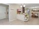 Open kitchen view with tile floors, a functional island, and views into the dining area at 12809 N 50Th St, Scottsdale, AZ 85254