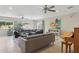 Bright living room with large windows, tile flooring, and a comfortable seating arrangement for entertaining at 12809 N 50Th St, Scottsdale, AZ 85254