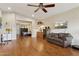 Open living room with hardwood floors and a view into the main bedroom at 12809 N 50Th St, Scottsdale, AZ 85254