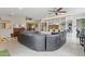 Open-concept living room with built-in shelving, ample seating, and a view into the dining area at 12809 N 50Th St, Scottsdale, AZ 85254