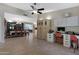 Open-concept living space with dining area, office space, and neutral tile flooring throughout at 12809 N 50Th St, Scottsdale, AZ 85254