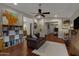 Comfortable living room showcasing hardwood floors, an elegant sofa, and bright lighting at 12809 N 50Th St, Scottsdale, AZ 85254