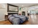 Spacious main bedroom featuring wood floors and a decorative mirror at 12809 N 50Th St, Scottsdale, AZ 85254