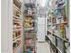 Organized pantry with shelving perfect for storage and a bright refrigerator at 12809 N 50Th St, Scottsdale, AZ 85254