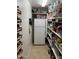 Well-organized pantry with shelves stocked full of goods and additional spice racks at 12809 N 50Th St, Scottsdale, AZ 85254