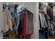 Organized walk-in closet with plenty of hanging space and visible hardwood floors at 12809 N 50Th St, Scottsdale, AZ 85254