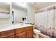 Bathroom with vanity, mirror, toilet, and a shower with a curtain at 14575 W Mountain View Blvd # 925, Surprise, AZ 85374