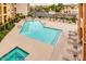 Inviting community pool with comfortable lounge chairs and a relaxing spa area for residents to enjoy at 14575 W Mountain View Blvd # 925, Surprise, AZ 85374