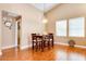 Cozy dining area with hardwood floors, pendant lighting, and two windows at 14575 W Mountain View Blvd # 925, Surprise, AZ 85374