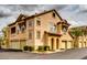 Exterior of a two-story townhome featuring a private garage, stucco exterior, and red tile roof at 14575 W Mountain View Blvd # 925, Surprise, AZ 85374