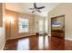 Living room featuring hardwood floors, natural light, and a ceiling fan creating a comfortable atmosphere at 14575 W Mountain View Blvd # 925, Surprise, AZ 85374