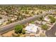 An elevated aerial shot highlighting the lush landscaping and neighborhood layout of the property at 15602 N 56Th Pl, Scottsdale, AZ 85254