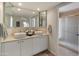 Bright bathroom with a double vanity sink, large mirror, and tile floors at 15602 N 56Th Pl, Scottsdale, AZ 85254