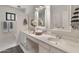 Bathroom featuring a double vanity with countertop and modern white cabinetry at 15602 N 56Th Pl, Scottsdale, AZ 85254