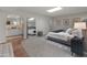 Bedroom featuring a large mirror, tufted bed, carpet flooring, and a skylight at 15602 N 56Th Pl, Scottsdale, AZ 85254