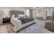 Bright bedroom showcasing a large tufted bed, carpet flooring, and modern lamps at 15602 N 56Th Pl, Scottsdale, AZ 85254