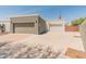 Three-car garage provides ample parking and storage space with a large driveway and clean design at 15602 N 56Th Pl, Scottsdale, AZ 85254