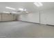 Spacious garage with epoxy floor features ample storage cabinets and plenty of room for vehicles at 15602 N 56Th Pl, Scottsdale, AZ 85254