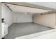 Spacious garage with epoxy floor features ample storage cabinets and plenty of room for vehicles at 15602 N 56Th Pl, Scottsdale, AZ 85254